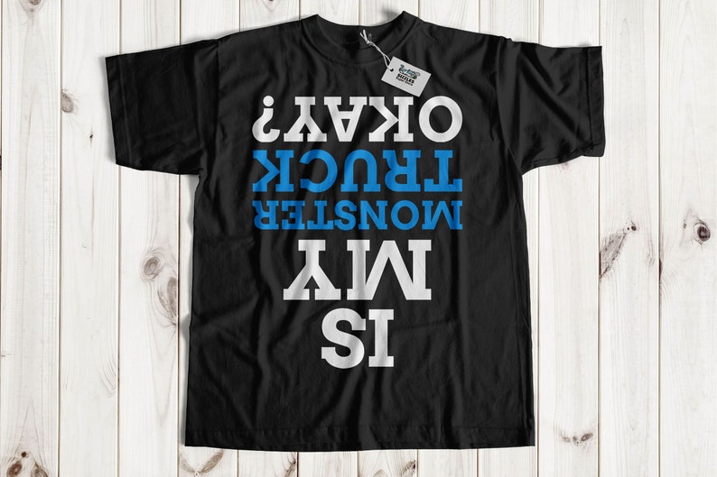 May include: Black t-shirt with white text that reads "Is My Monster Truck Okay?"