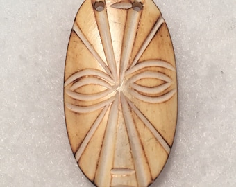 Primitive mask - bone carved tribal amulet