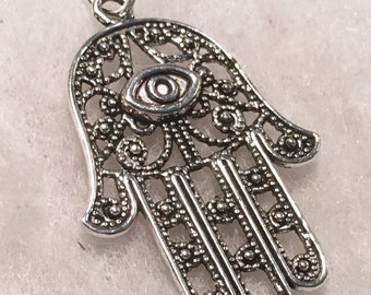 Hamsa - spiritual palm shaped silver plated filigree amulet.