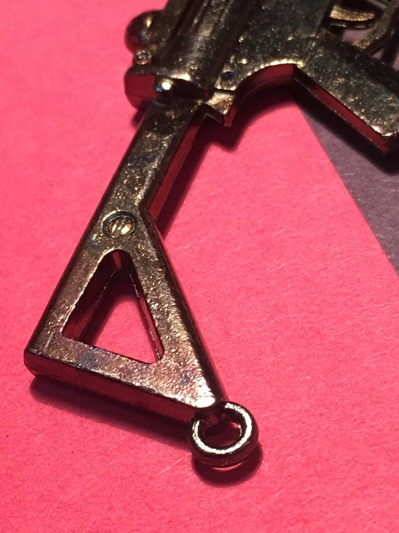 Machine Gun vintage pendant