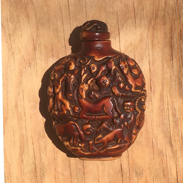 Vintage carved cinnabar snuff / perfume bottle.