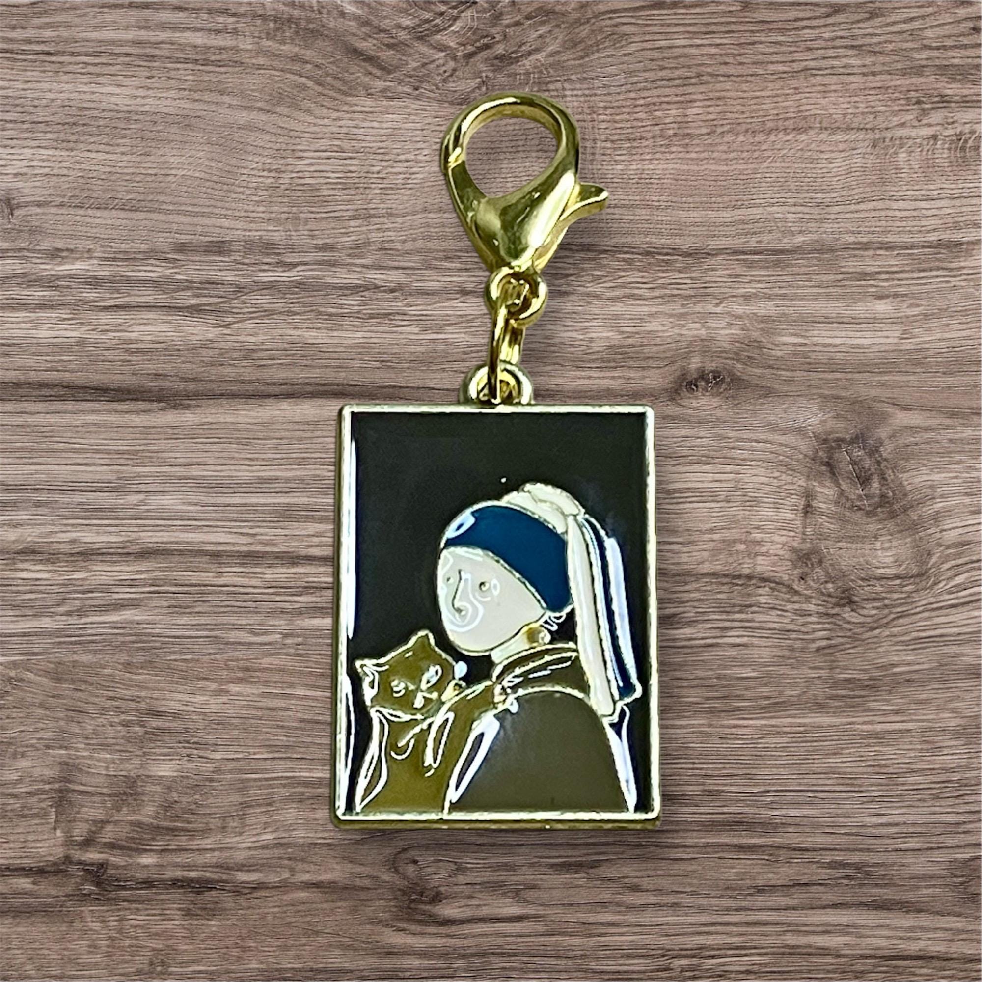 Johannes Vermeer's "Girl with a Pearl Earring," - vintage enamel charm on 18K gold plated spinner.
