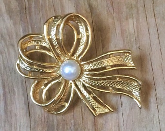 Nœud d’or - épinglette de bijoux vintage