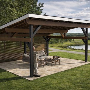 May include: An outdoor pavilion featuring a dark metal frame and natural wood beams with a slanted roof. The structure includes a slatted wood privacy wall on one side and is set on a stone patio, housing a sofa, armchairs, and a coffee table.