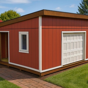 May include: A red shed with a brown roof and white trim. The shed features a white garage door and a small window. The door is open, revealing the interior. The shed is on a brick patio, surrounded by green grass and trees.