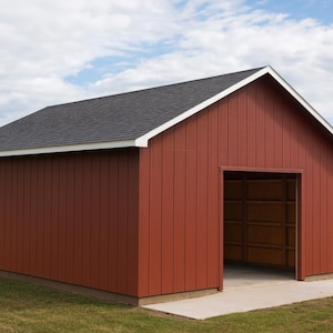 May include: A red barn-style shed with a dark gray roof and white trim. The shed has an open doorway and sits on a concrete slab. The background includes green grass, trees, and a cloudy blue sky.