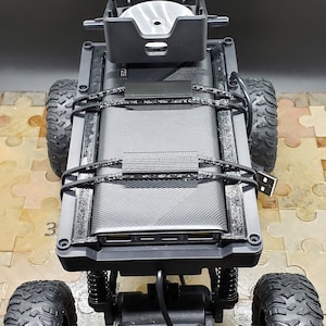 3D Printed Improved Battery Holder for Wyze Car.  Wyze Car/Cam/Battery/Wheels not included.