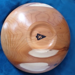 Beautiful hand turned yew bowl with epoxy filled holes