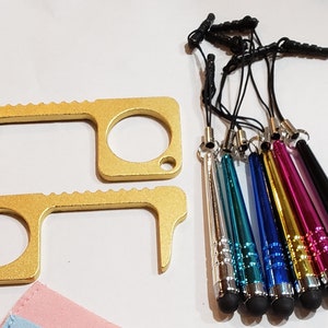May include: Two gold-colored touch tools with a textured grip and a loop for attaching to a keychain.  The tools are designed to help avoid touching surfaces.  There are seven colorful stylus pens with black tips and black lanyards.