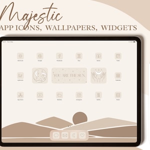 May include: A digital tablet displaying a beige and brown landscape with a sunset. The screen shows a grid of app icons with minimalist line drawings of moons, stars, and waves. The text "YOU ARE THE SUN" appears on one of the icons.