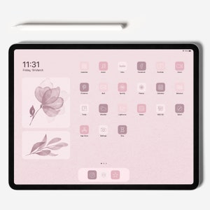 May include: A pink iPad screen with a watercolor floral design and a grid of app icons. The icons are outlined in white and include apps like Calendar, Music, Hulu, Facebook, YouTube, Zoom, Pinterest, Mail, Spotify, Photos, Calendar, Behance, Trello, Weather, Lightroom, Notes, HBO GO, Safari, App Store, Settings, and Etsy. The time is 11:31 and the date is Friday, 19 March.