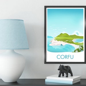 May include: A framed art print of Corfu island with a black frame. The print features a coastal landscape with green hills, blue water, and the word "CORFU" in white. A white lamp with a blue lampshade and a black bear figurine are on a dark surface.
