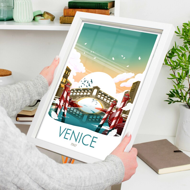 May include: A framed illustration of Venice, Italy, featuring a bridge over a canal with gondolas and the text "VENICE ITALY".