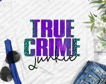 May include: A white t-shirt with a purple and blue graphic that says "True Crime Junkie". The graphic has a leopard print design around the edges.