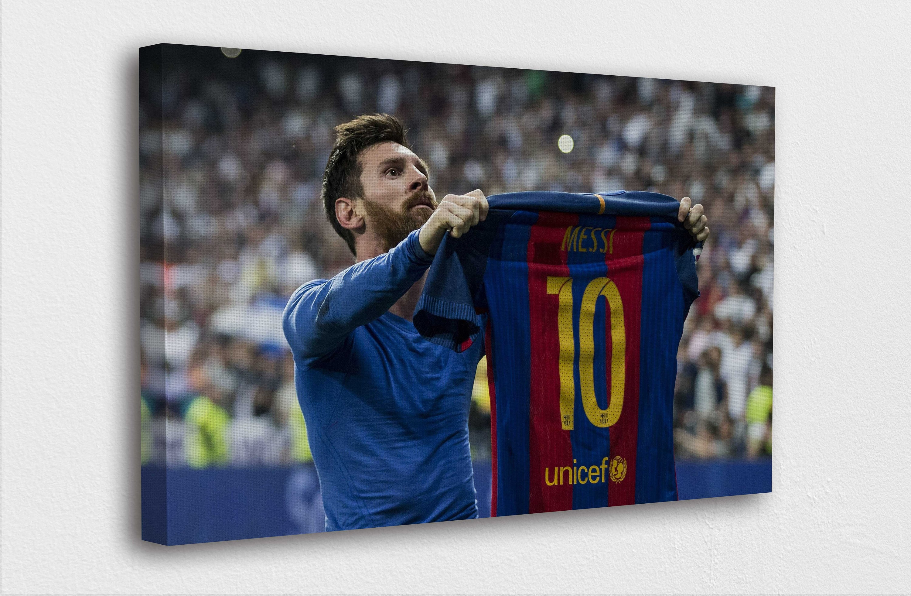 Messi holding his best sale jersey