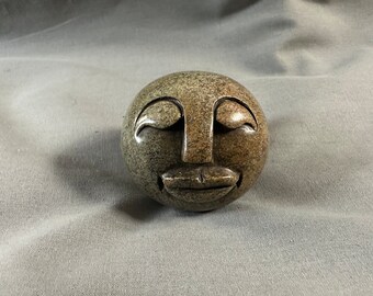 Stone face paperweight