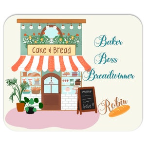 May include: A cartoon illustration of a bakery storefront with a sign that reads "Cake & Bread". The bakery is decorated with red and white striped awning, green plants, and light bulbs. The text "Baker Boss Breadwinner Robin" is written in cursive on the right side of the image. A loaf of bread is depicted below the text.