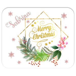 May include: A white, square-cornered Christmas-themed design with a gold geometric frame and the words "Merry Christmas" in gold script. The design includes a wreath of green pine needles, red berries, and pink accents, with the name "Sabrina" in a cursive font.