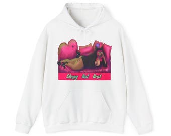 May include: White hoodie with a pink and purple illustration of a woman laying on a couch with a cat. The text "Sleepy Bat Brat" is printed below the illustration.