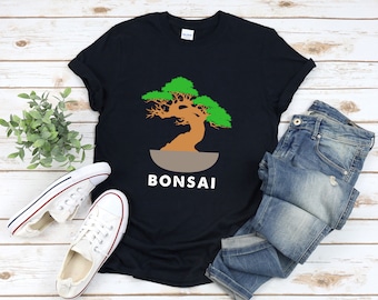 May include: A black t-shirt with a green bonsai tree graphic and the word "BONSAI" in white text.