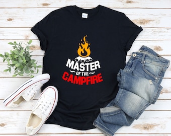May include: A black t-shirt with a graphic of a campfire and the text "Master of the Campfire".