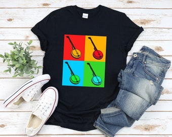 Könnte beinhalten: Schwarzes T-Shirt mit einem Pop-Art-Design aus vier Banjos mit verschiedenen Hintergrundfarben. Die Banjos sind alle in die gleiche Richtung ausgerichtet und haben ein ähnliches Design.
