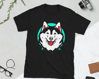 May include: Black t-shirt with a white husky dog graphic. The dog is smiling and has blue eyes. The dog is surrounded by a turquoise circle with white hearts.