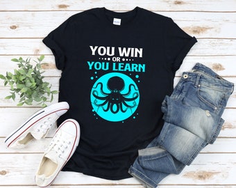 May include: Black t-shirt with a blue octopus graphic and the text "You win or you learn".