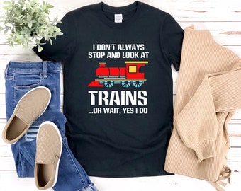 May include: Black t-shirt with a red, yellow, and blue cartoon train and the text "I don't always stop and look at trains...oh wait, yes I do."