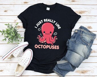 May include: A black t-shirt with a graphic of a pink octopus and the text "I just really like octopuses".