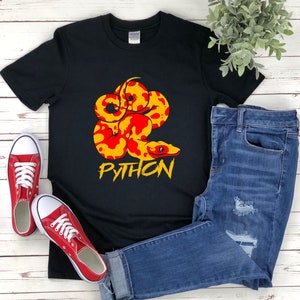 May include: Black t-shirt with a red and yellow snake design and the word "PYTHON" in white letters.