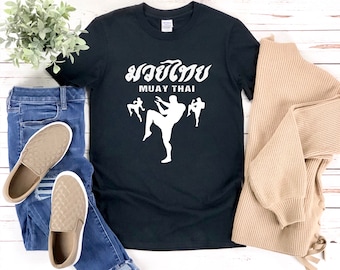 May include: Black t-shirt with a white graphic of a Muay Thai fighter and the text "Muay Thai" in Thai and English.