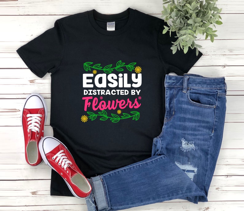 a t - shirt that says easily distracted by flowers