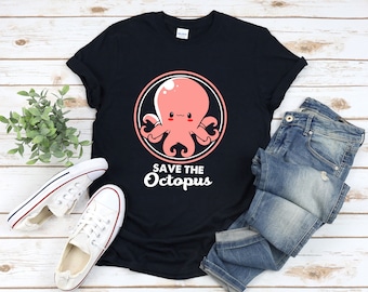 May include: A black t-shirt featuring a pink cartoon octopus in a circle with the text "Save the Octopus" underneath.