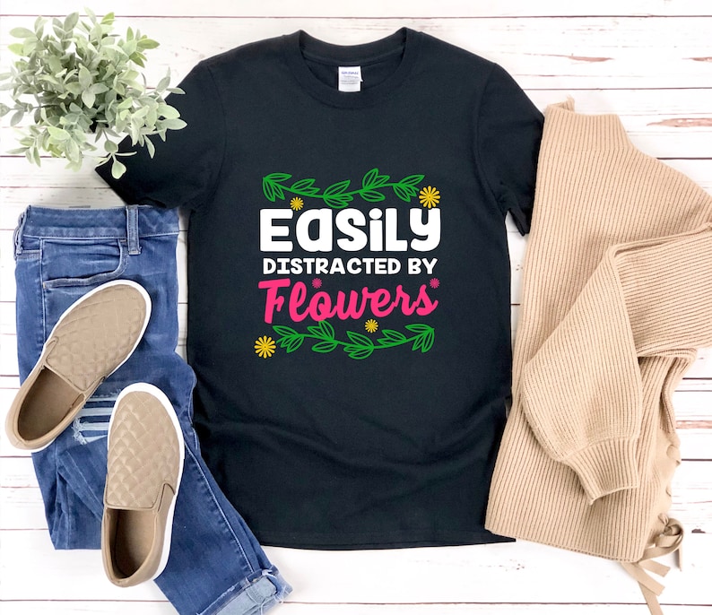 a t - shirt that says easily distracted by flowers