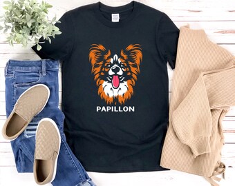 Puede incluir: Camiseta negra con un gráfico de un perro Papillón con pelaje naranja y blanco. El texto "Papillon" está impreso debajo del perro.