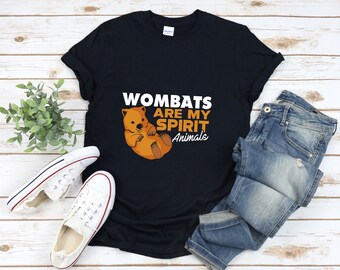 May include: A black t-shirt featuring a wombat graphic and the text "Wombats are my spirit animals".