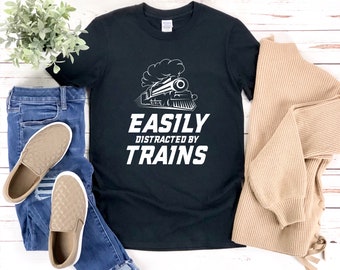 May include: Black t-shirt with a white graphic of a train and the text "EASILY DISTRACTED BY TRAINS".