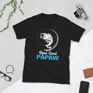 May include: Black t-shirt with a white graphic of a fish on a fishing line. The text "Reel Cool Papaw" is printed below the fish.