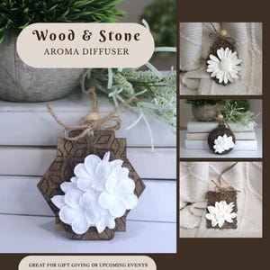 May include: A hanging aroma diffuser featuring a dark brown wooden base with a geometric pattern and a cluster of white stone flowers. The item includes a natural jute twine cord with a small wooden bead for hanging display.