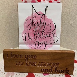Love you to the moon and back engraved wood sign