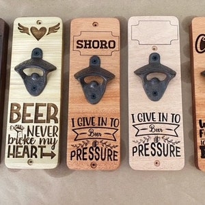 Wall / fence hanging beer bottle opener, engraved,  built in magnets to catch the bottle caps