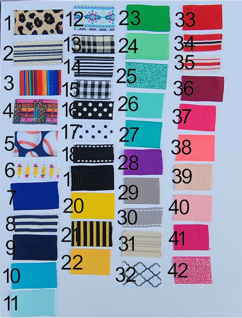 May include: A chart of 42 different ribbon samples, each with a unique pattern and color. The ribbons are numbered 1 through 42.