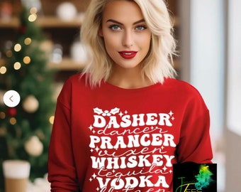 May include: A red sweatshirt with white text featuring the names of Santa's reindeer and alcoholic beverages. The text includes "Dasher, Dancer, Prancer, Vixen, Whiskey, Tequila, Vodka, Blitzen." The sweatshirt also has a logo in the bottom right corner.