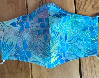 Best fitting washable face mask with filter pocket, nose wire and adjustable ear loops. Soft, breathable lining. Tropical blue batik.