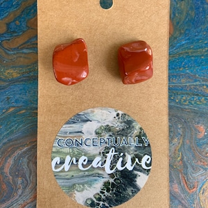 Natural, polished red jasper stud earrings.