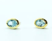 Blue topaz stud earrings silver bicolor, oval