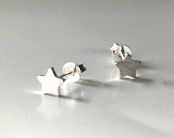 delicate silver star stud earrings