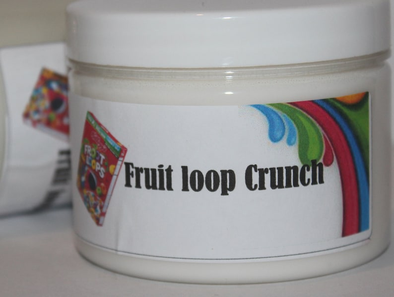 May include: A white jar with a white lid and a label that says "Fruit Loop Crunch". The label has a rainbow design with a cartoon box of Fruit Loops cereal.