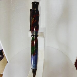 Multicolor swirl. Twist pen, has some blue, green, orange gold and red